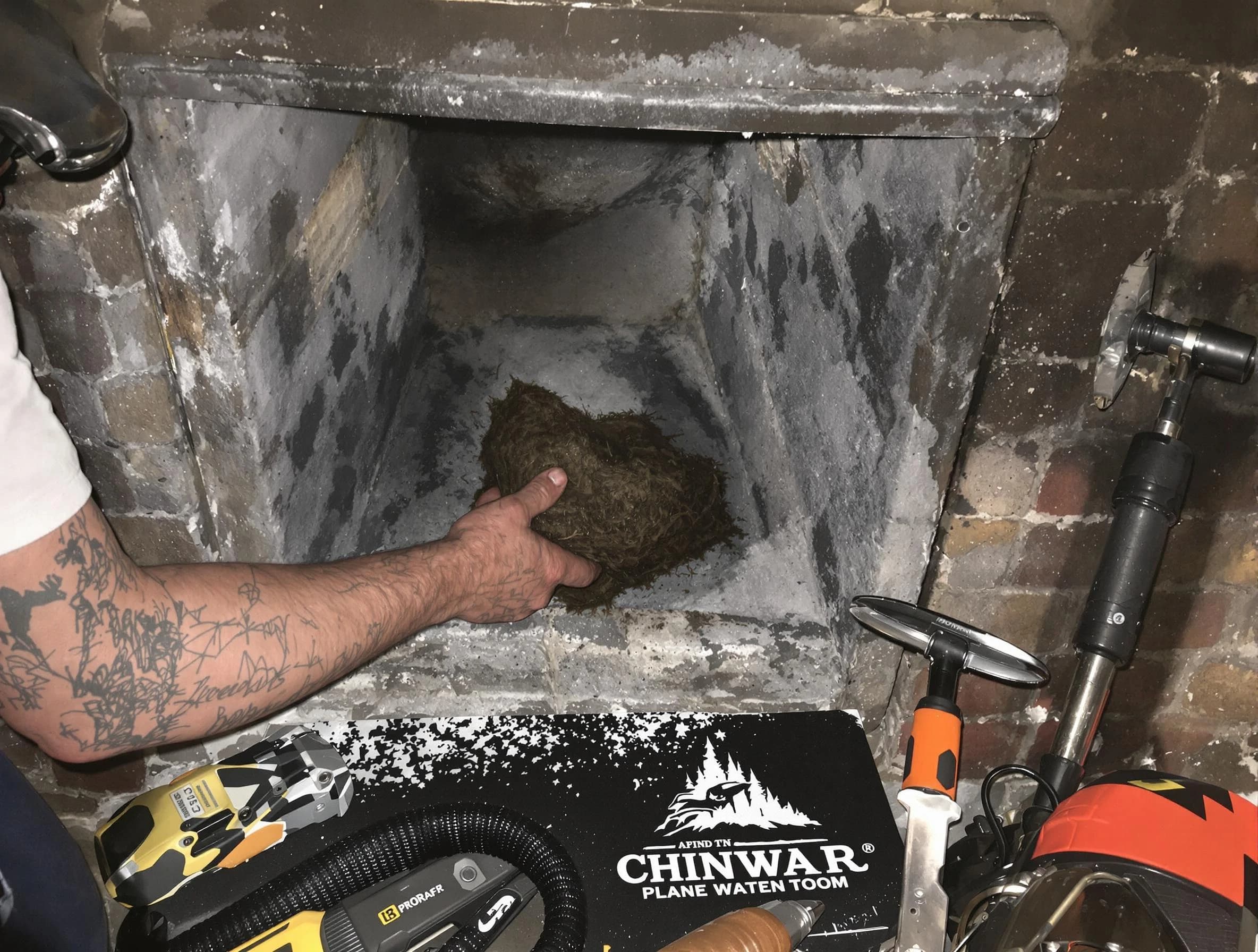 Mansfield Chimney Sweep safely removing debris and screening chimney in Mansfield, MA