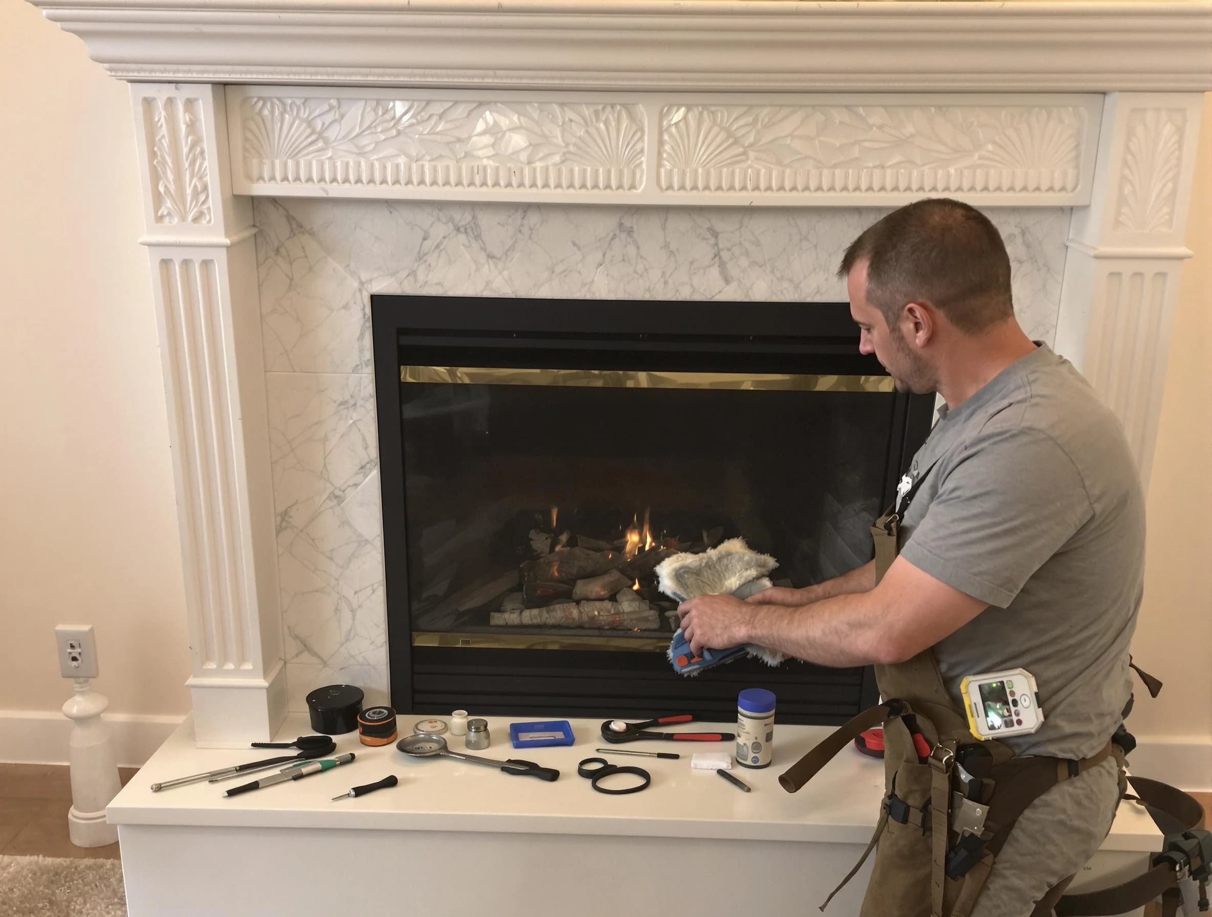 Mansfield Chimney Sweep performing fireplace maintenance in Mansfield, MA